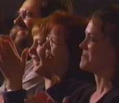 Audience members clapping